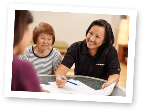 Oahu home care service provider speaking with senior aging in place with help of home caregiver